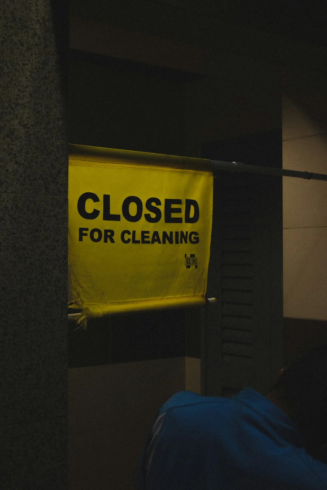 Cleaner cleaning the floor in a laboratory environment
