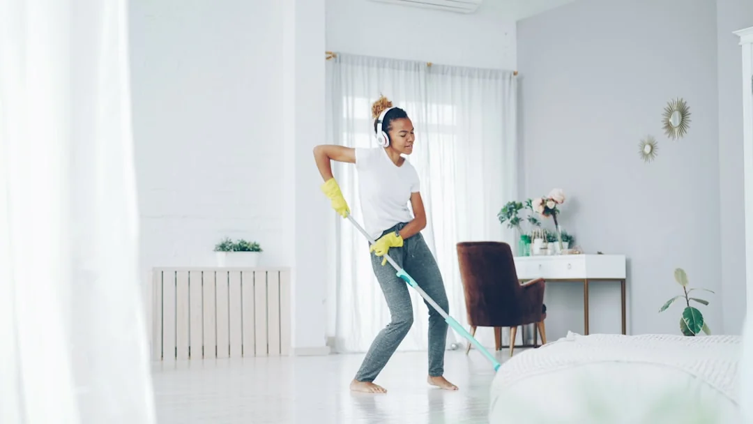 person-holding-yellow-plastic-spray-bottle-zmnefoi3k